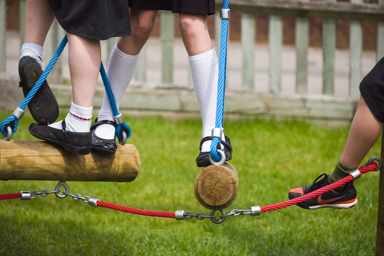 Children playing on playground equipment