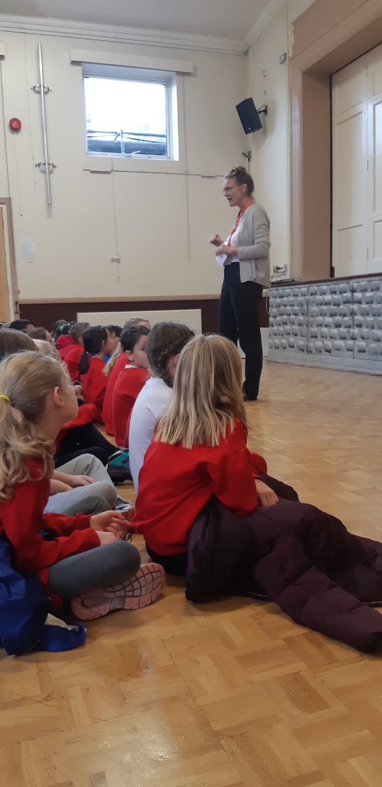 teacher taking assembly