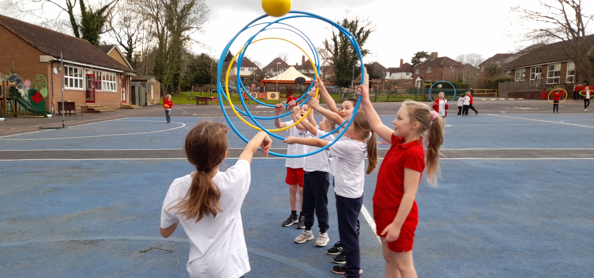 Children playing sport on school playground