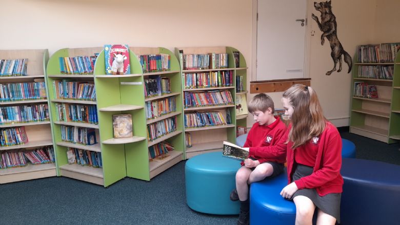 Children reading in library