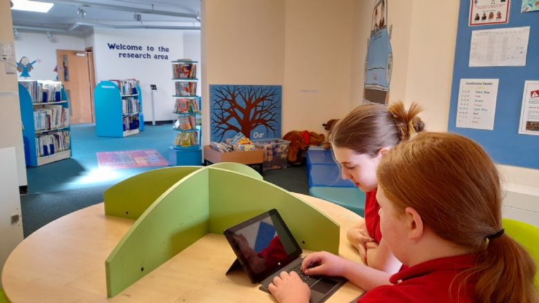 children working in library